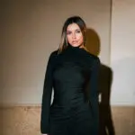 Mini Long Sleeved Dress With High Neckline And Vertical Fold Detail -Black